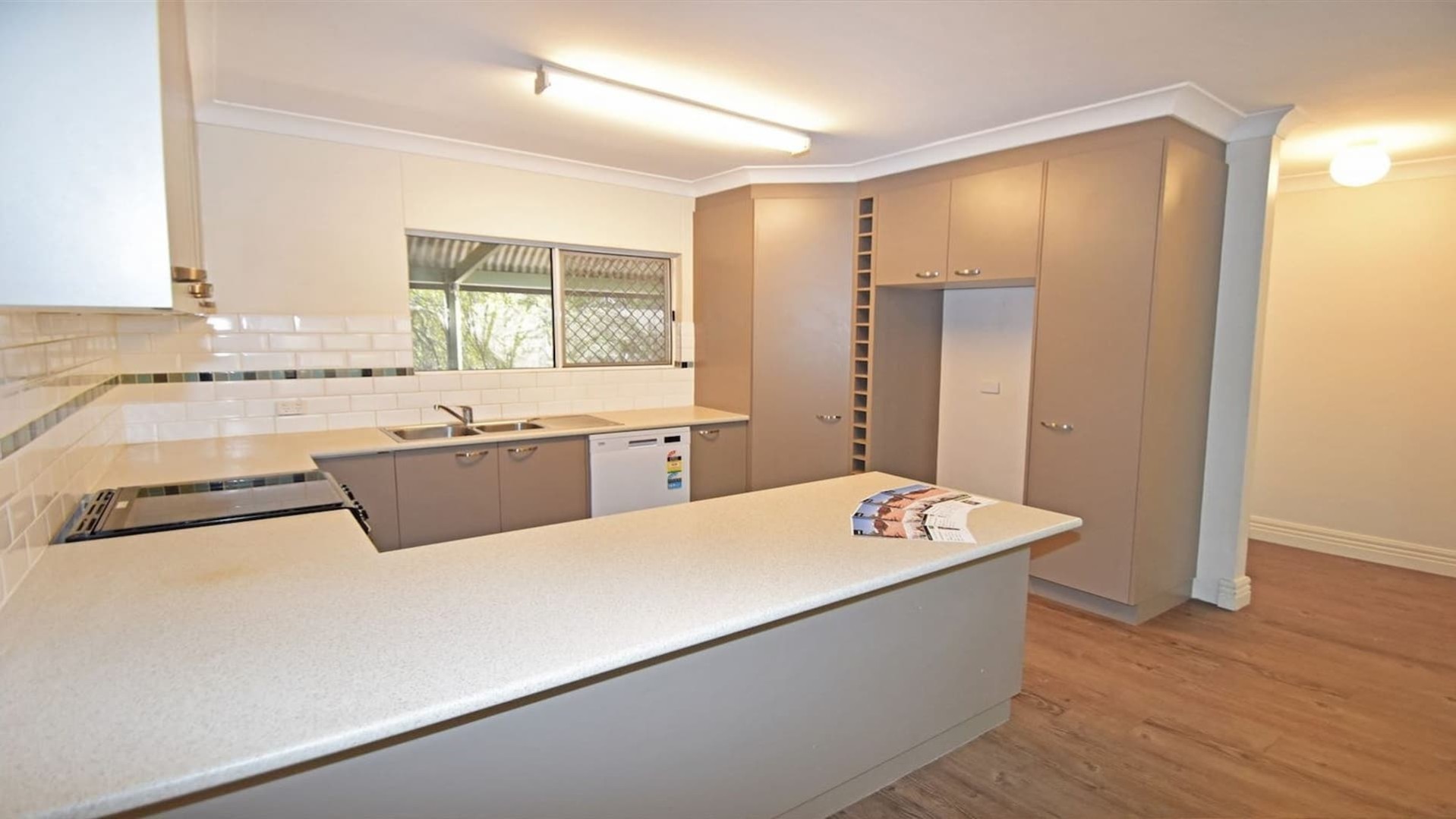 u-shaped kitchen, with plenty of bench space and cupboards for storage.