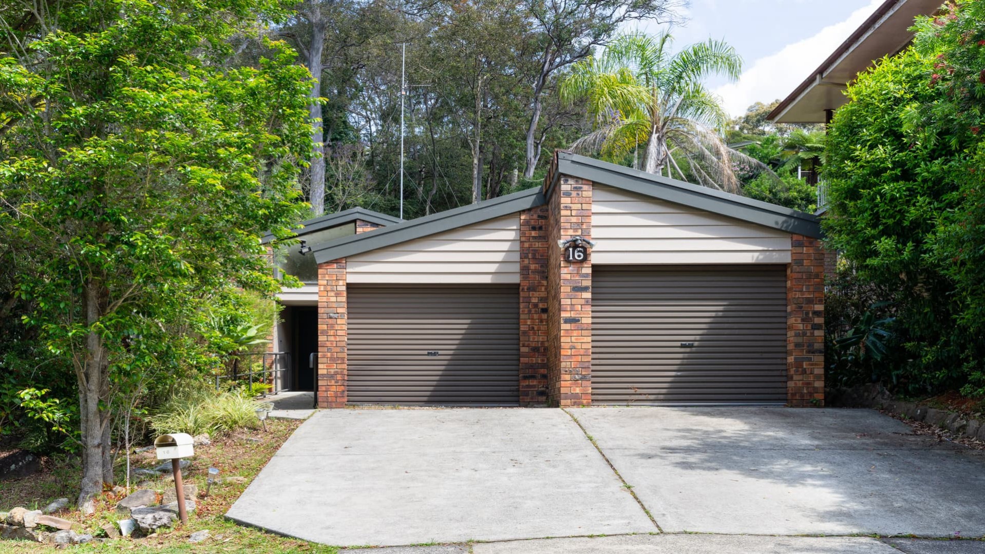 front exterior of house with double lock up garage.