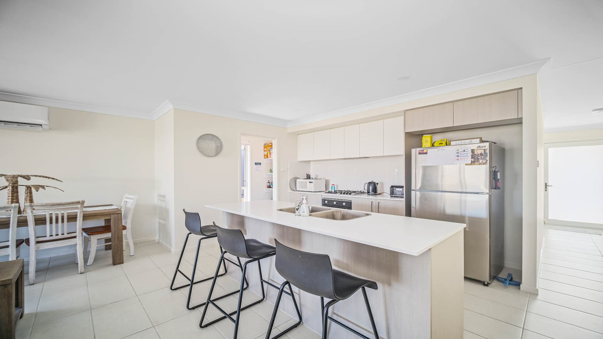 Kitchen bench with stools for dining at the bench.
