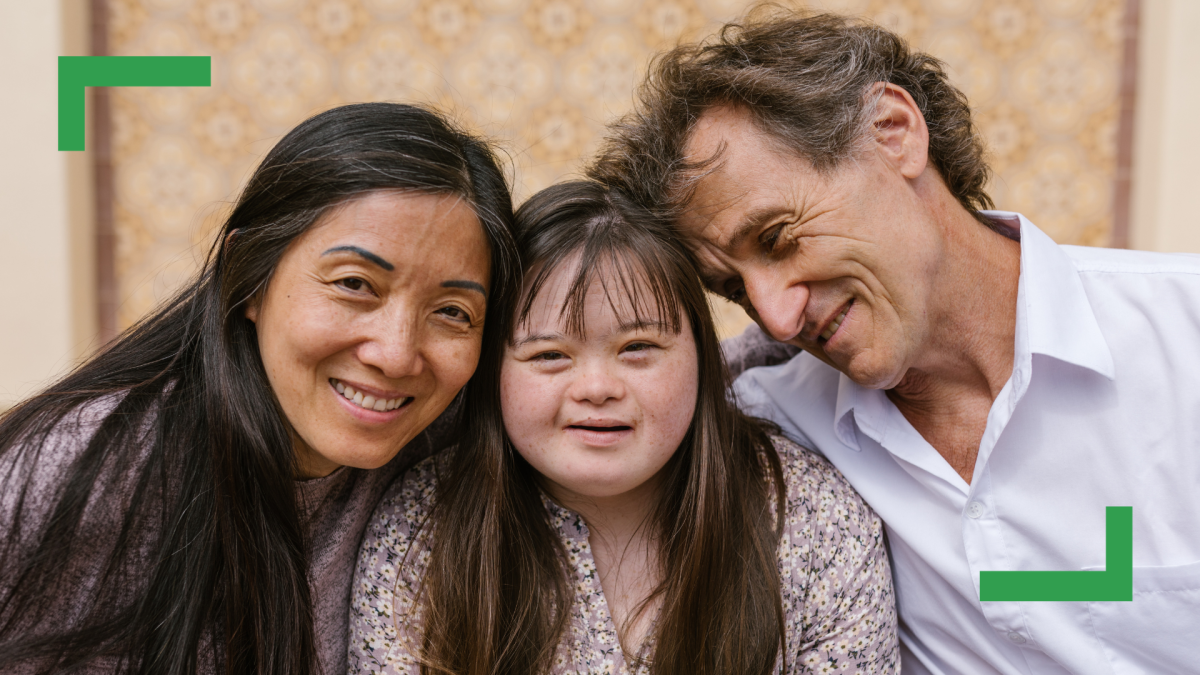 A family of three standing close together.