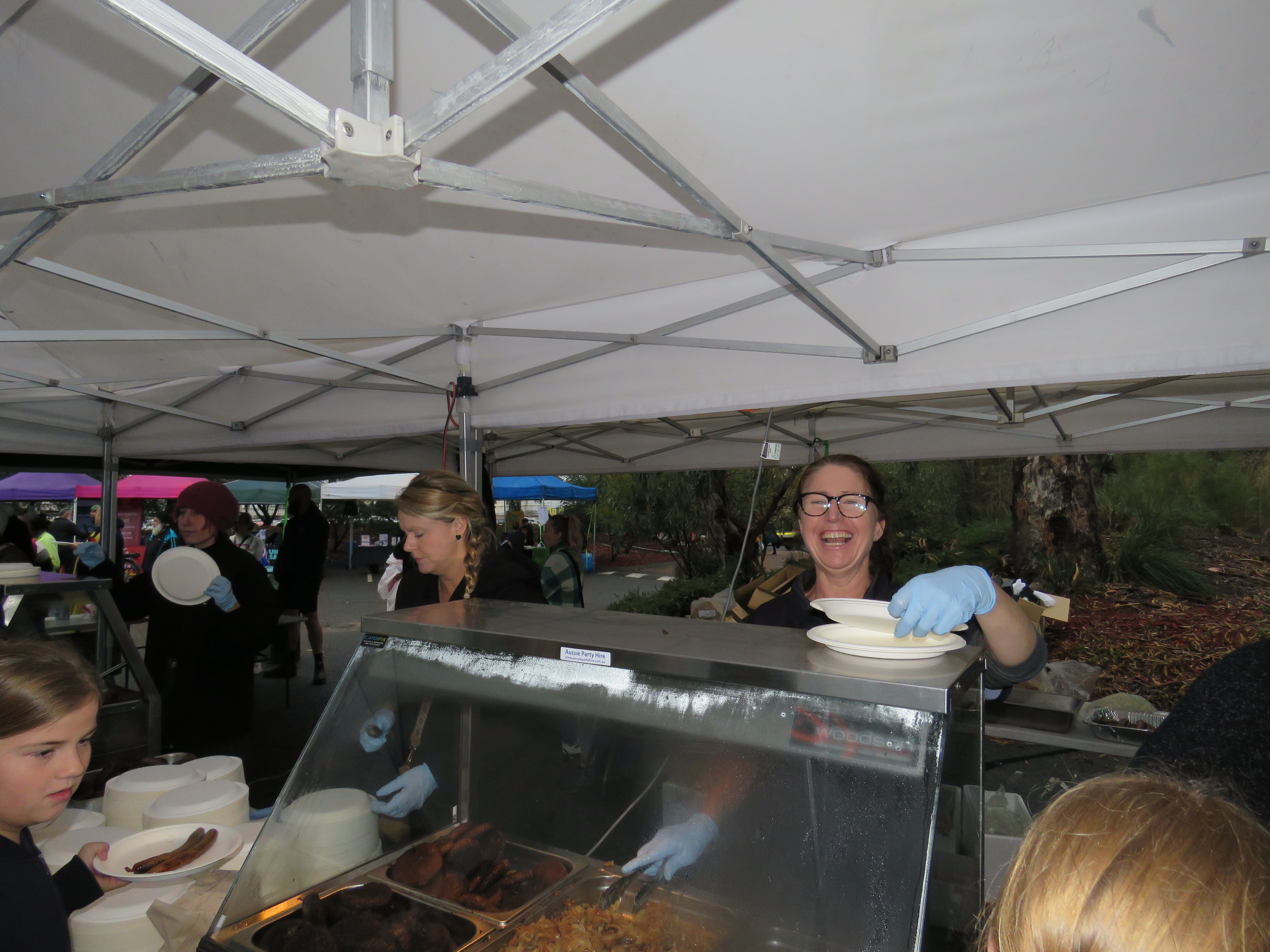 Staff helping with the BBQ at Rec in the West.
