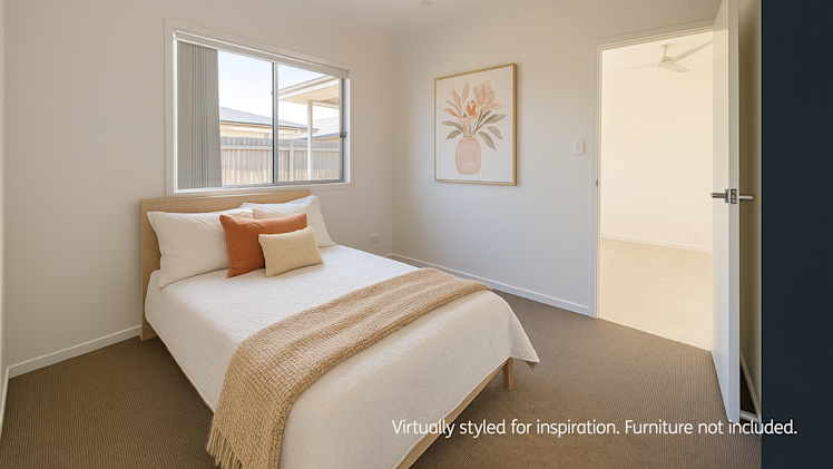 Bright bedroom with a double bed dressed in white bedding, tan throw blanket, and accent cushions, featuring a large window, ceiling fan, and framed floral artwork on the wall."