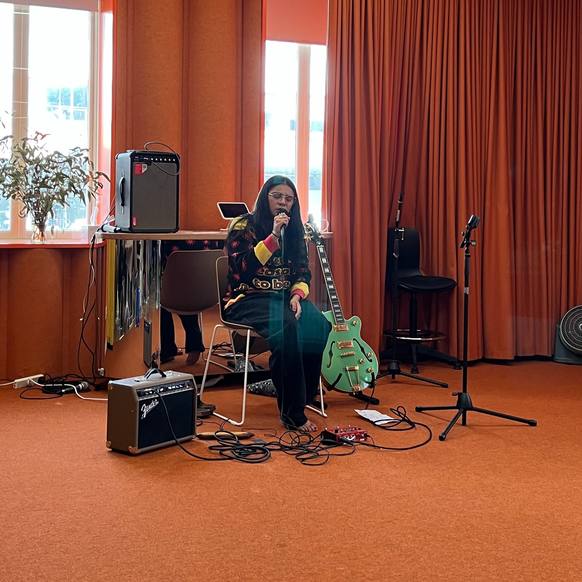 Leonie Whyman playing guitar at the City of Darebin's lunch time NAIDOC Week Celebration.
