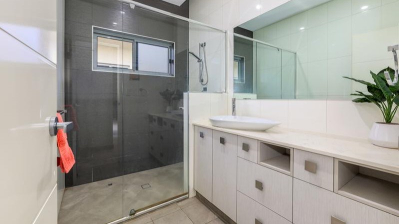 Large bathroom with a shower.