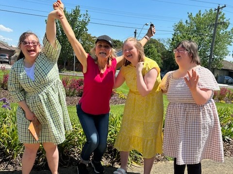 Livvy, Kristie and Sam outside in a garden