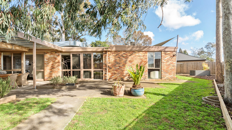--Front of the Greensborough house with a pathway leading to the front door.--