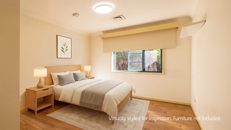 Bedroom with hard wood flooring, window and blind.