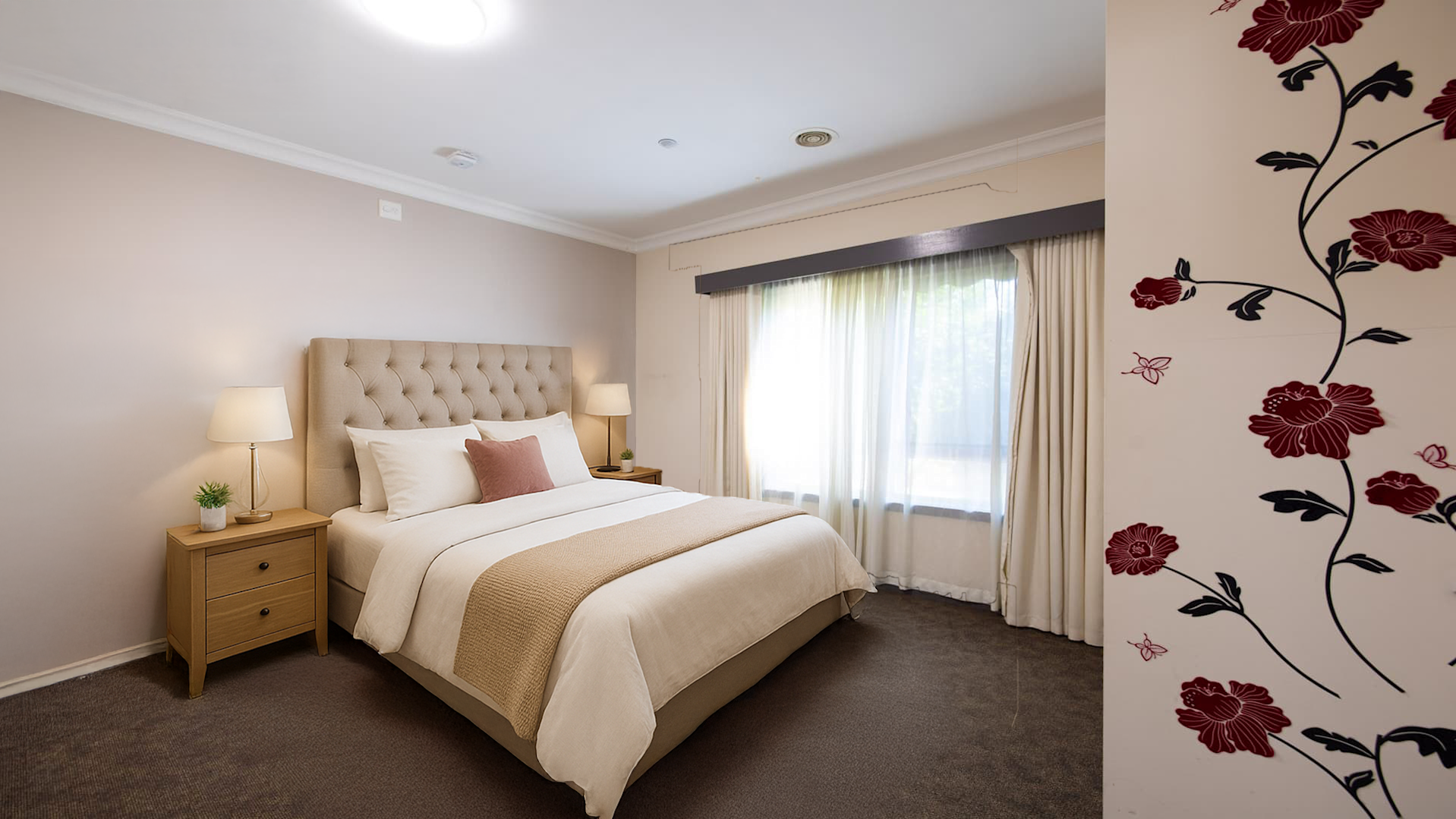 Grey carpeted vacant bedroom with large curtained window, grey carpet and heating plus cooling.