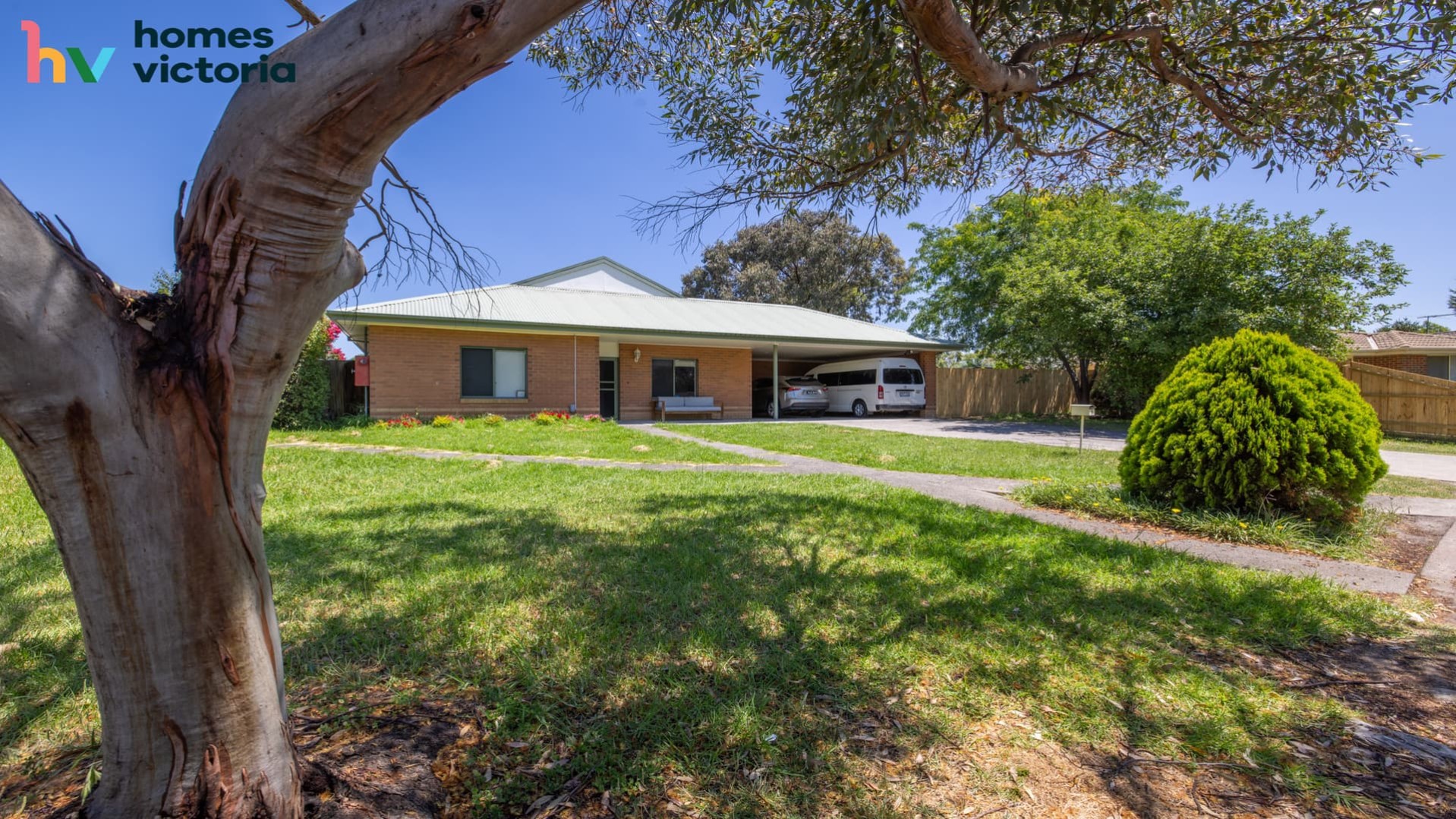 single level brick house set back on the block with long entry and spacious lawned area.