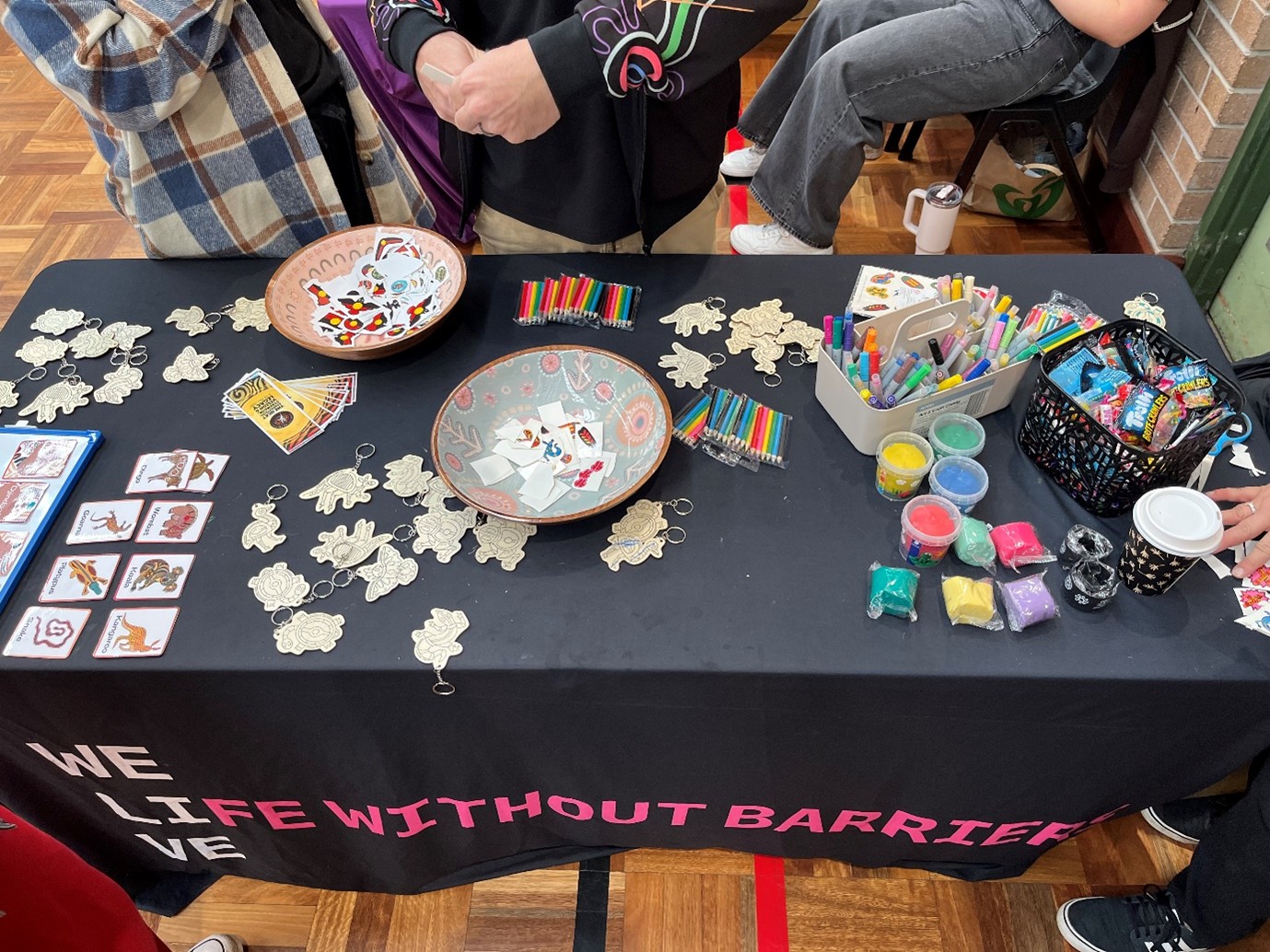 Birds eye view of the activities laid out on the table at the Life Without Barriers stall.