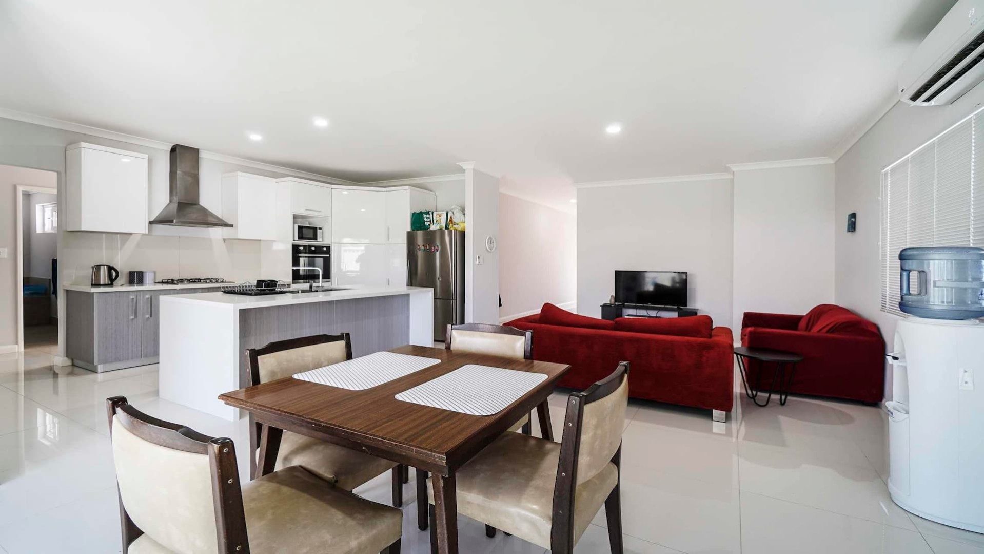 open plan kitchen, overlooking dining and lounge space