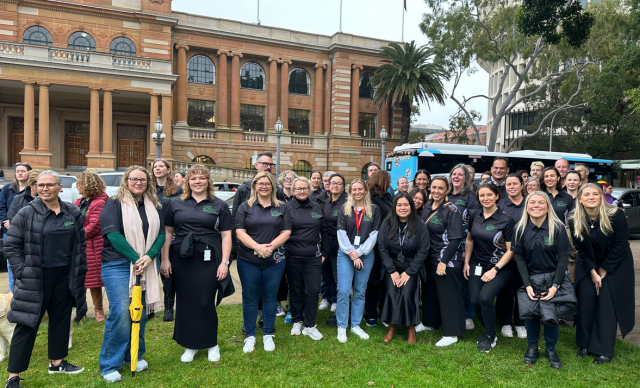 Life Without Barriers staff gather in a large group at the Awabakal Community NAIDOC March.