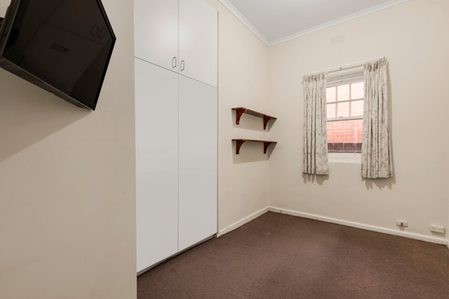 --Bedroom with carpet, BIR, wall mounted TV.--