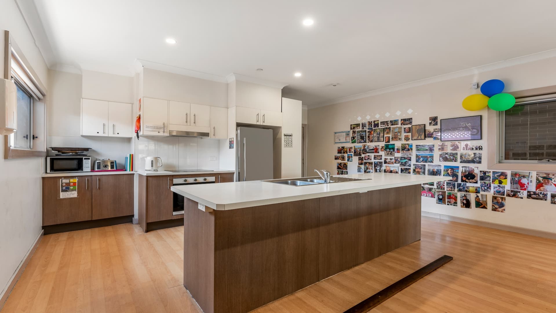 open plan kitchen with hard wood flooring