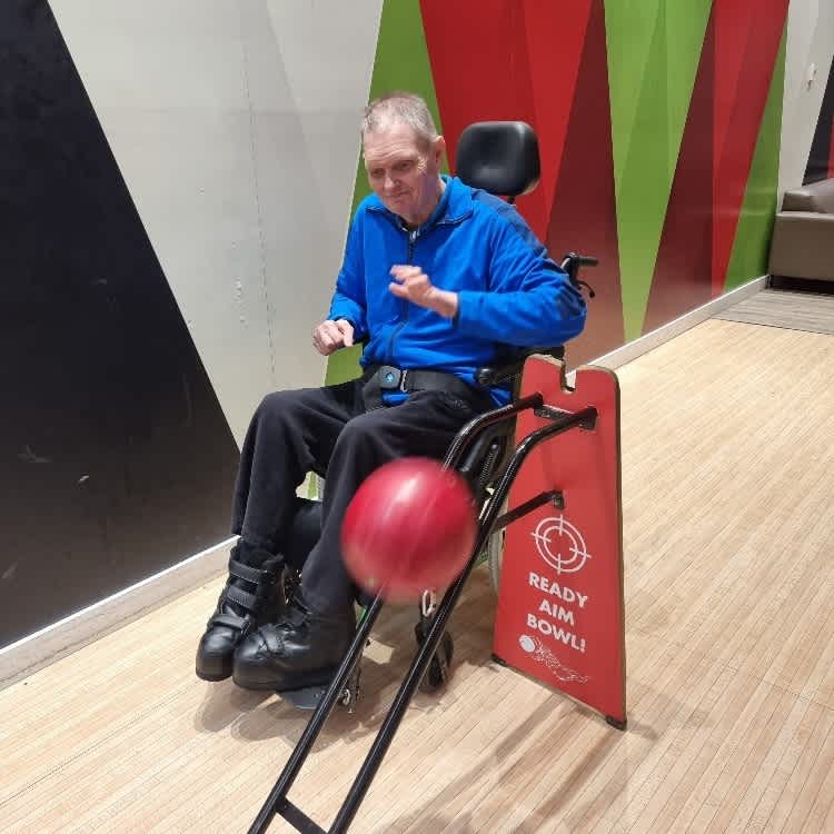 Bruce playing a game of bowling.