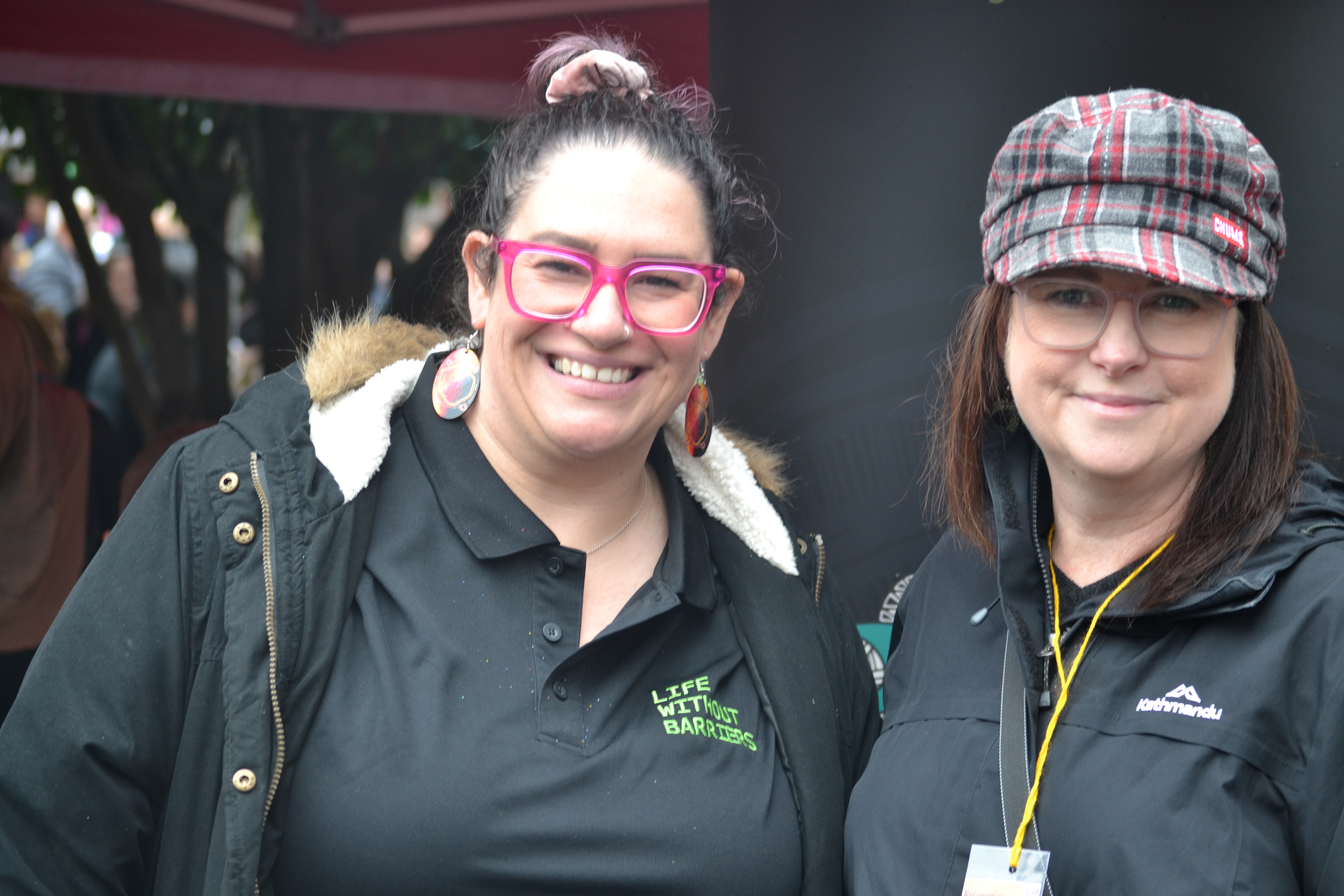 Two staff members smiling at the camera at Rec in the West.