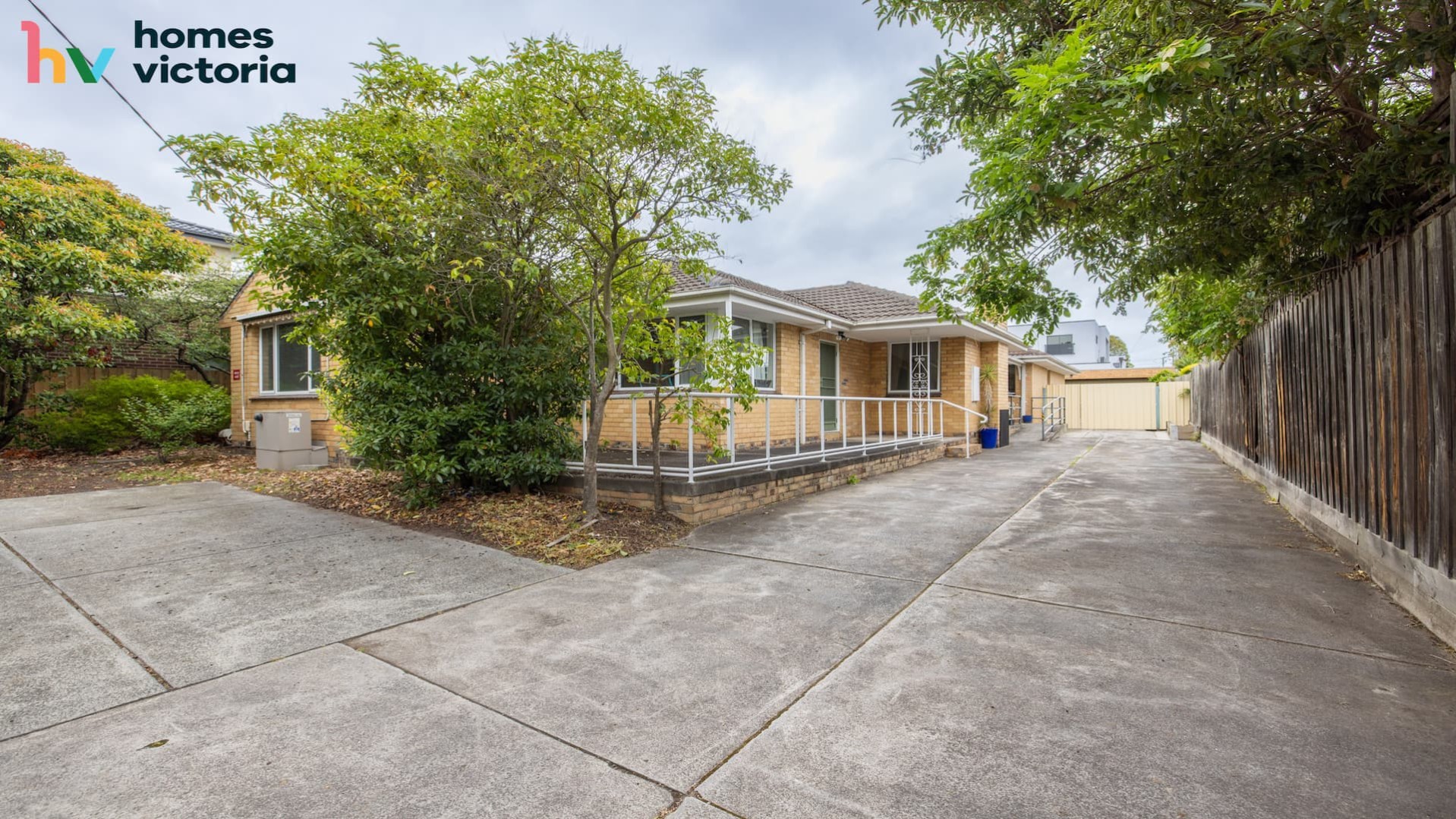 concrete driveway and ramp entrance option into the house.