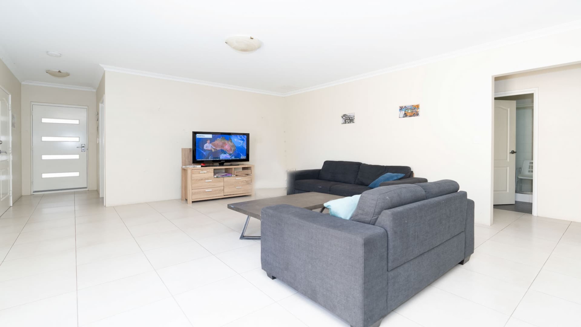 loungeroom with TV and coffee table.