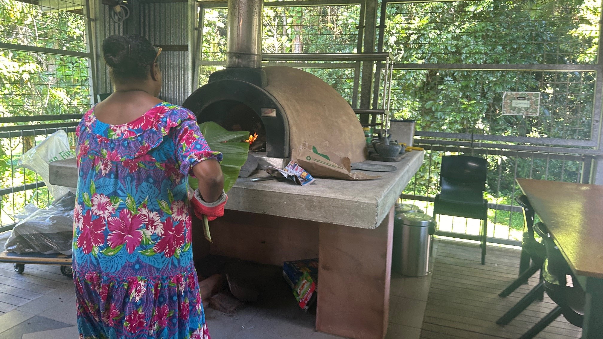 A person places damper in a large oven.