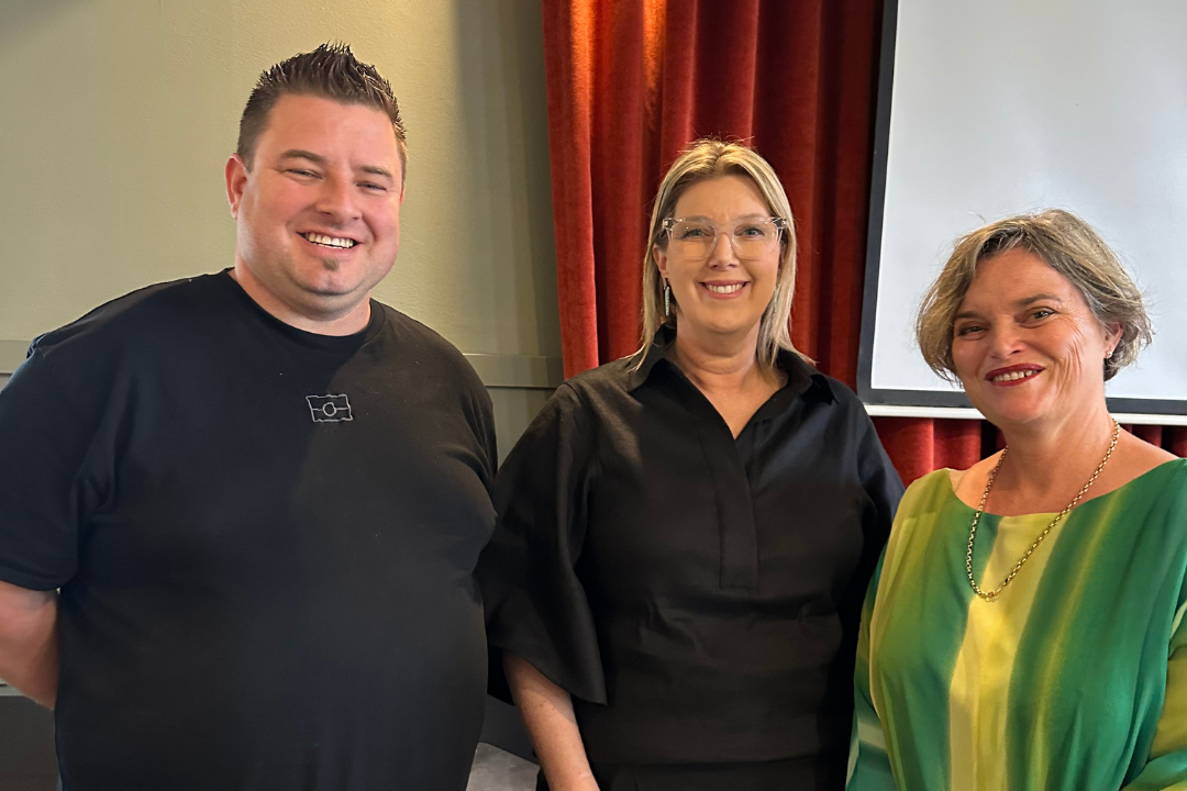 Daniel Ross, Kylie Drummy, Director CYF Victoria, and Tessa Hughes, Manager of the Carer Support Team at FCAV, smiling at the camera.