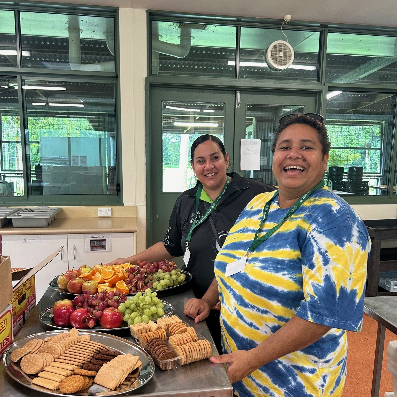 Two people prepare food at Cultural Camp for young people at the Daradgee Environmental Education Centre.
