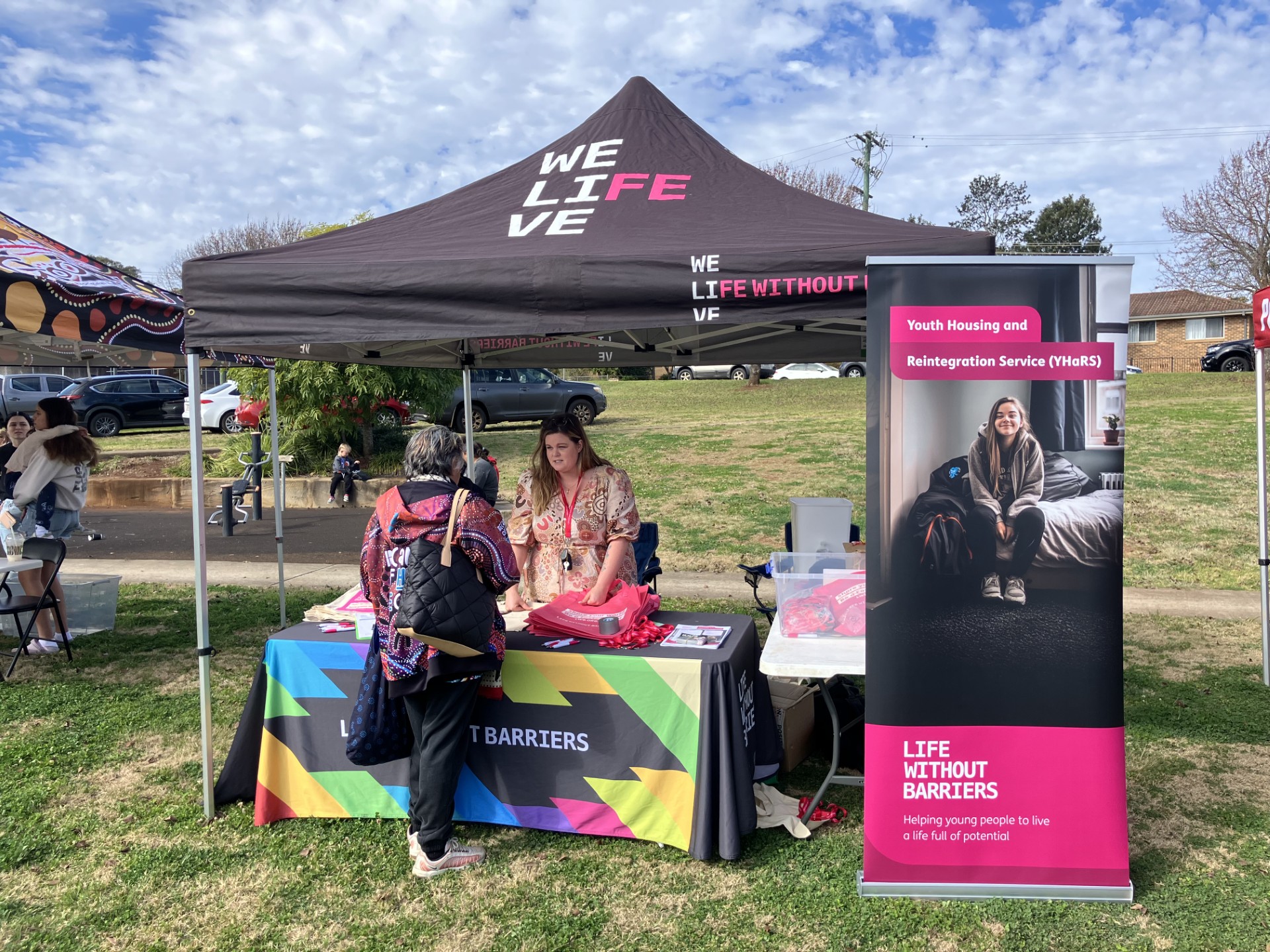 Staff engaging with community at the Wilsonton Heights Neighbourhood Centre NAIDOC event.