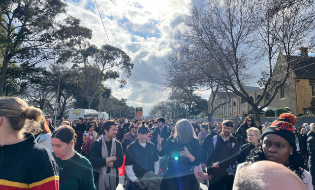 Community members and staff walking in the march.