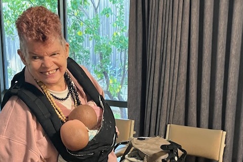 Dianne with her two dolls. 