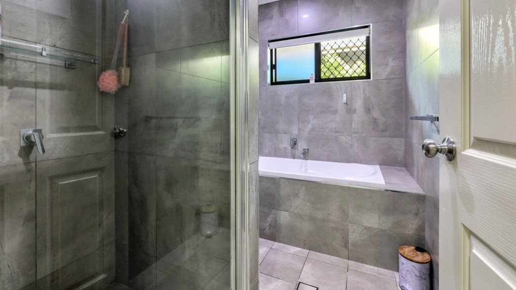 Modern bathroom with large shower and bath.