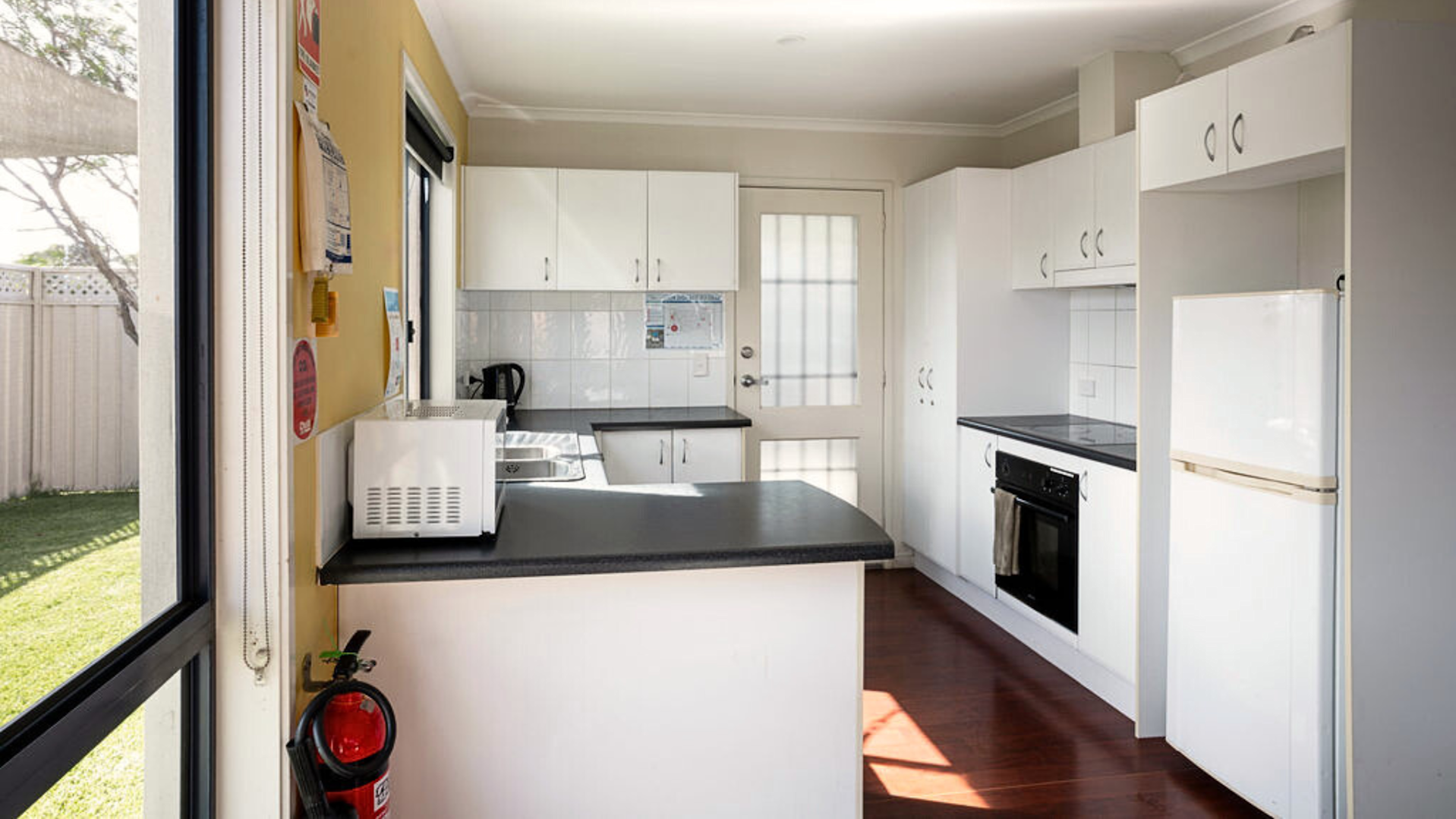 Kitchen with white cabinets.