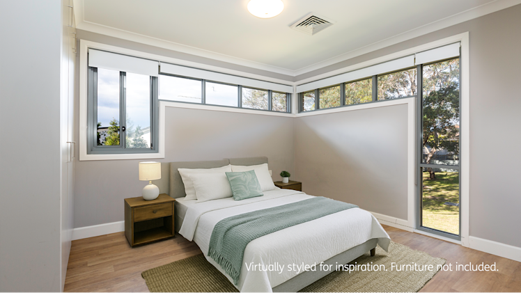 Modern bedroom with light grey walls, minimalist decor, and unique wraparound high-set windows allowing natural light.