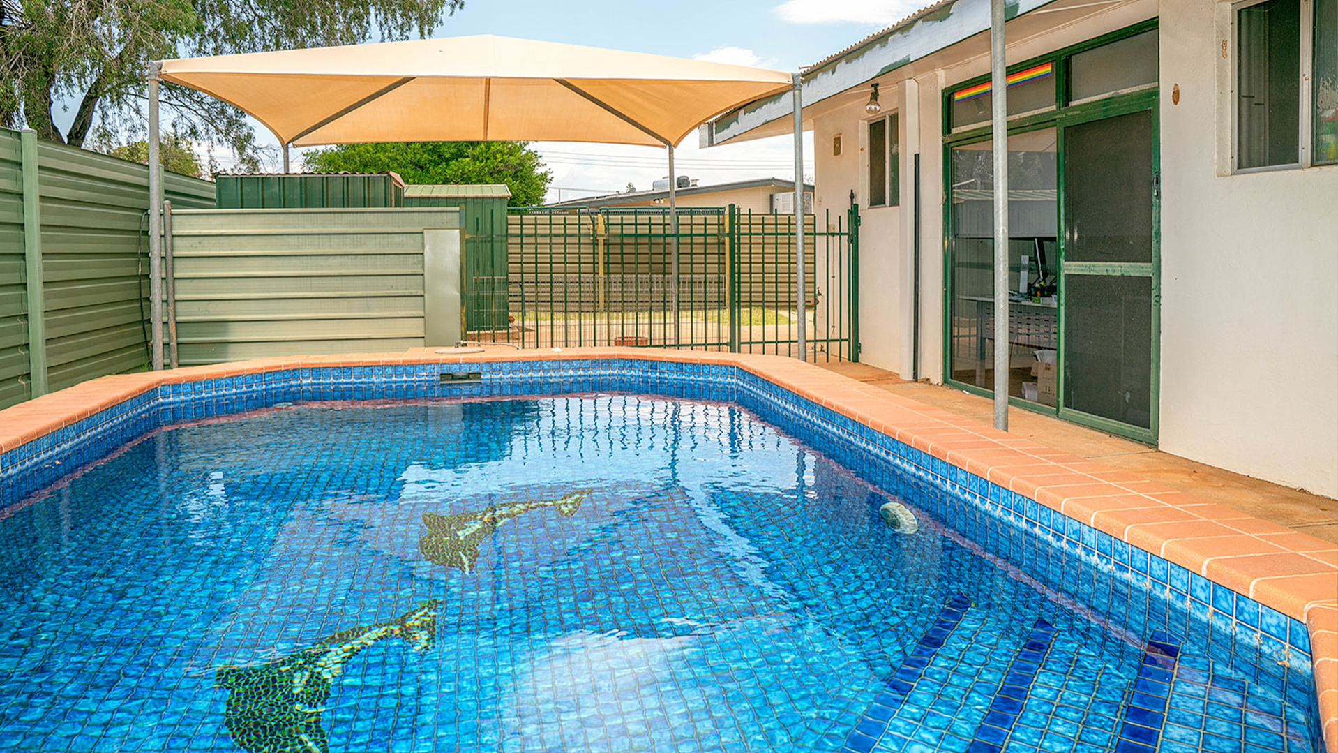 --large outdoor pool with cover.--