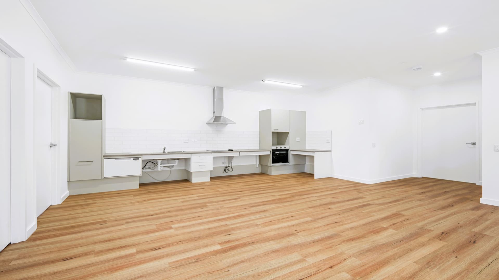 Combined open plan living space, including modern kitchen, dining and loungeroom.