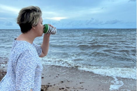 Nicolette enjoying a coffee at the beach