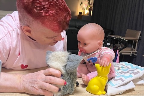 Dianne with her one of her dolls. 