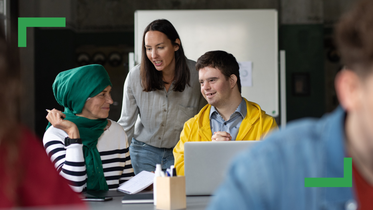 Three people sitting together at a table.