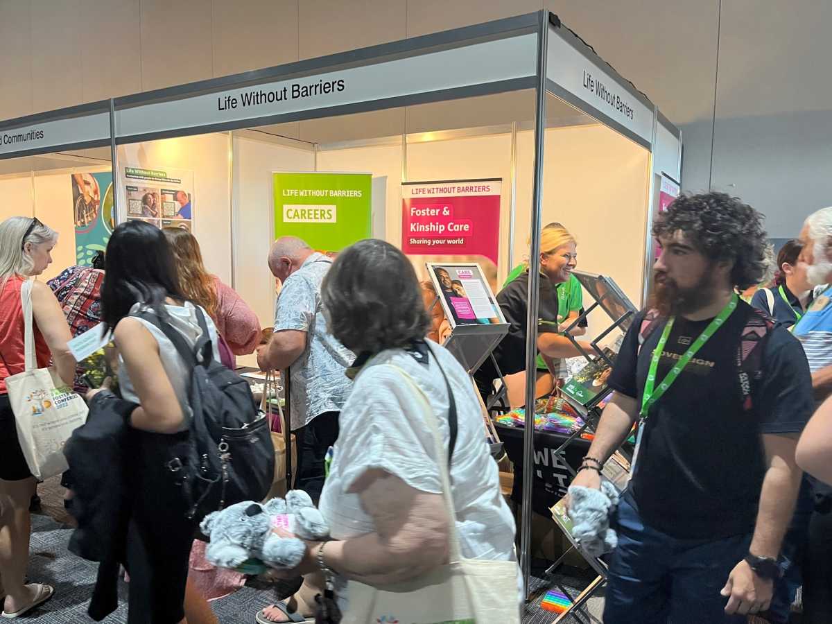 Exhibition Booth with staff and people.