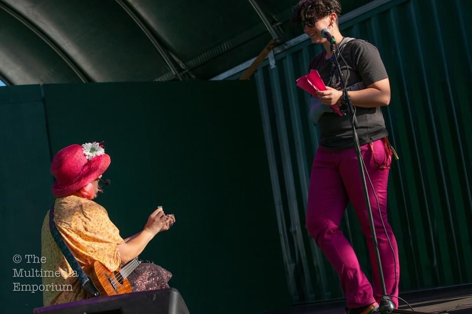 Phi proposing to her girlfriend on stage.