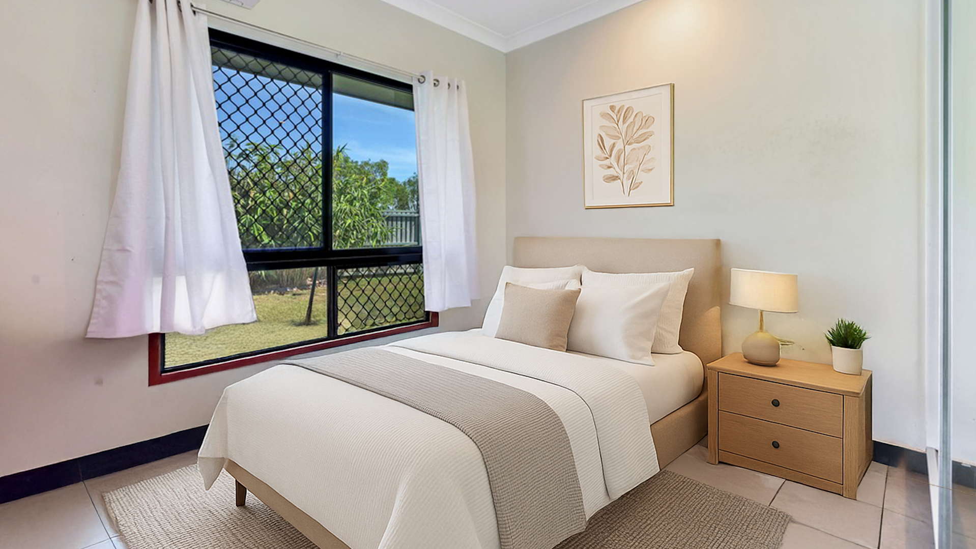 --Bedroom with a tiled floor and large window. There is double bed and bedside table. The room also has a wardrobe with sliding doors and a mirror.--