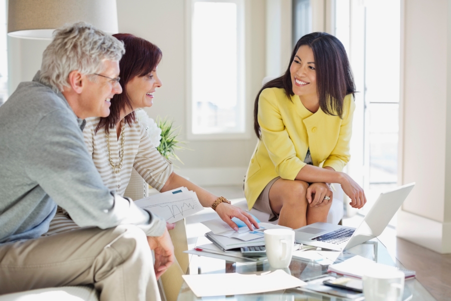 Couple talking to a real estate agent