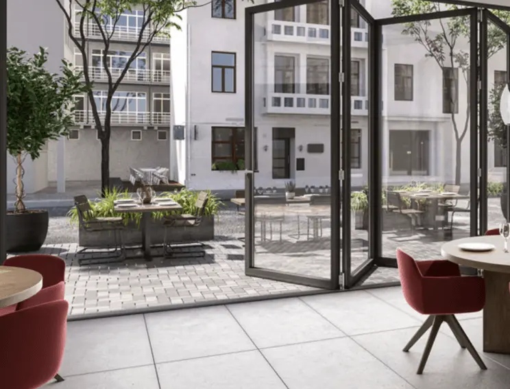 This is a photograph of a room with a bi-folding glass door.