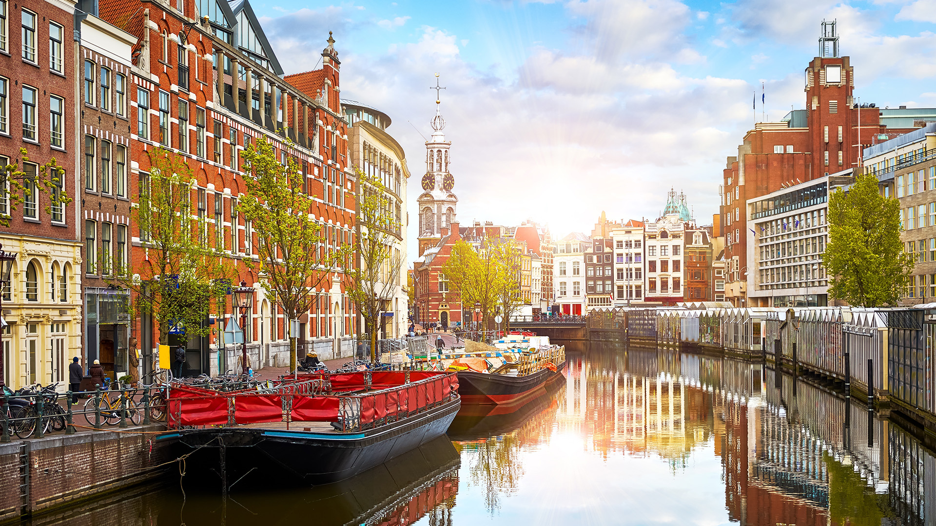 netherlands-amsterdam-houses-canals-boat-sundown-swiper-hero-gallery