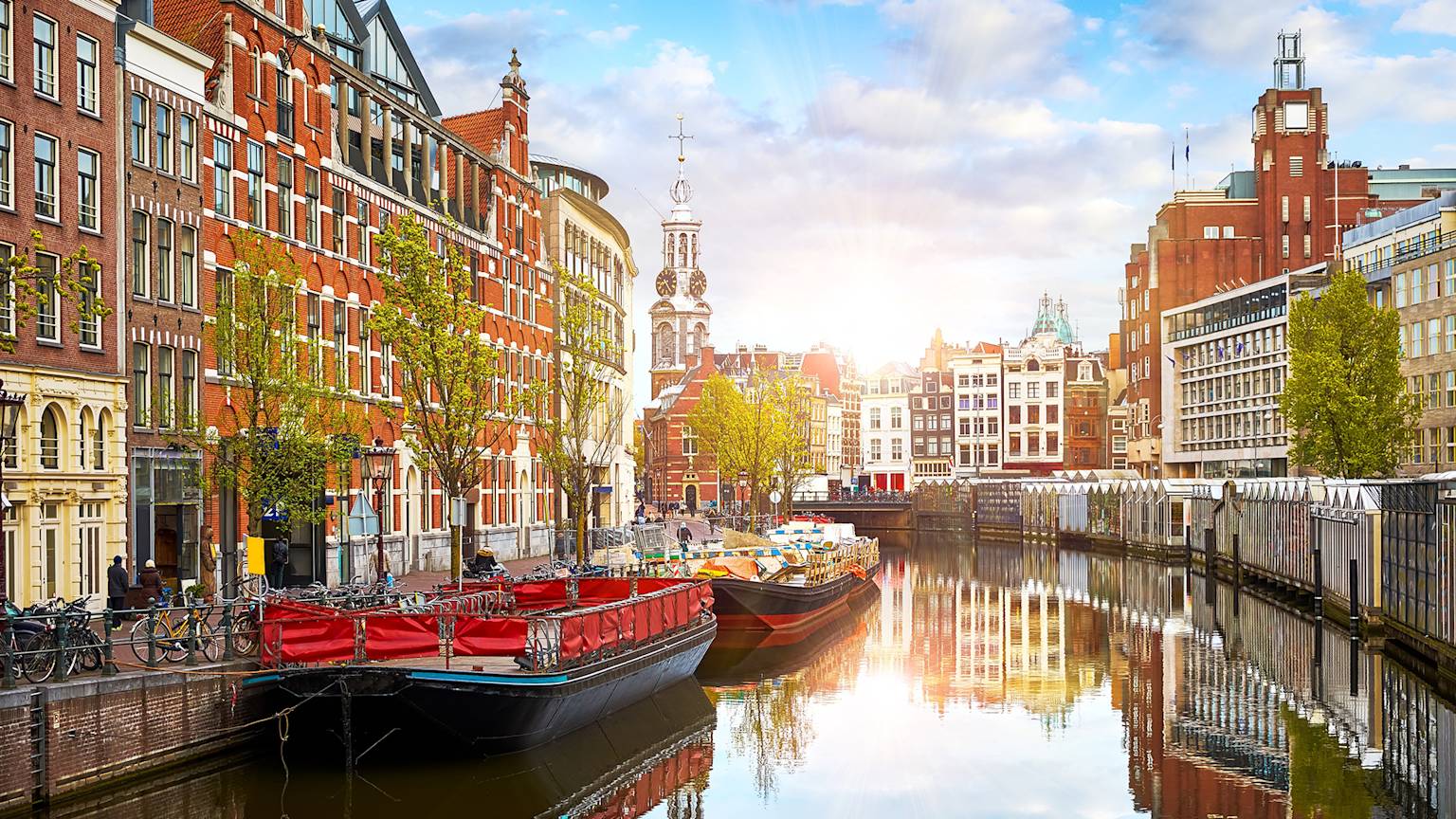 netherlands-amsterdam-houses-canals-boat-sundown-swiper-hero-gallery