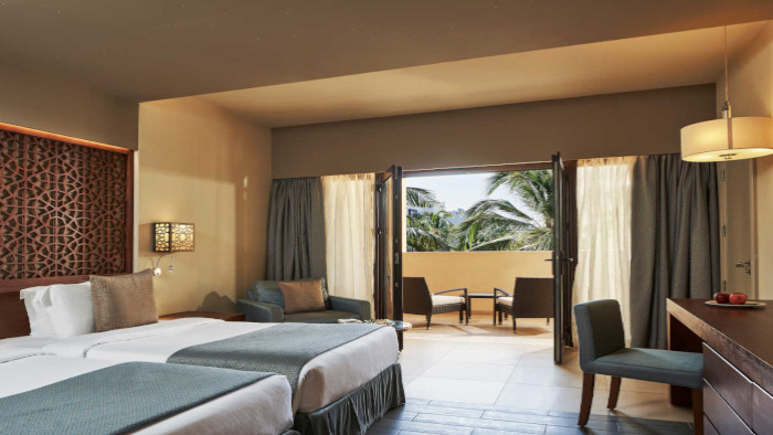 fanar-hotel-and-residences-hawana-salalah-oman-handicapped-bedroom-deluxe-room