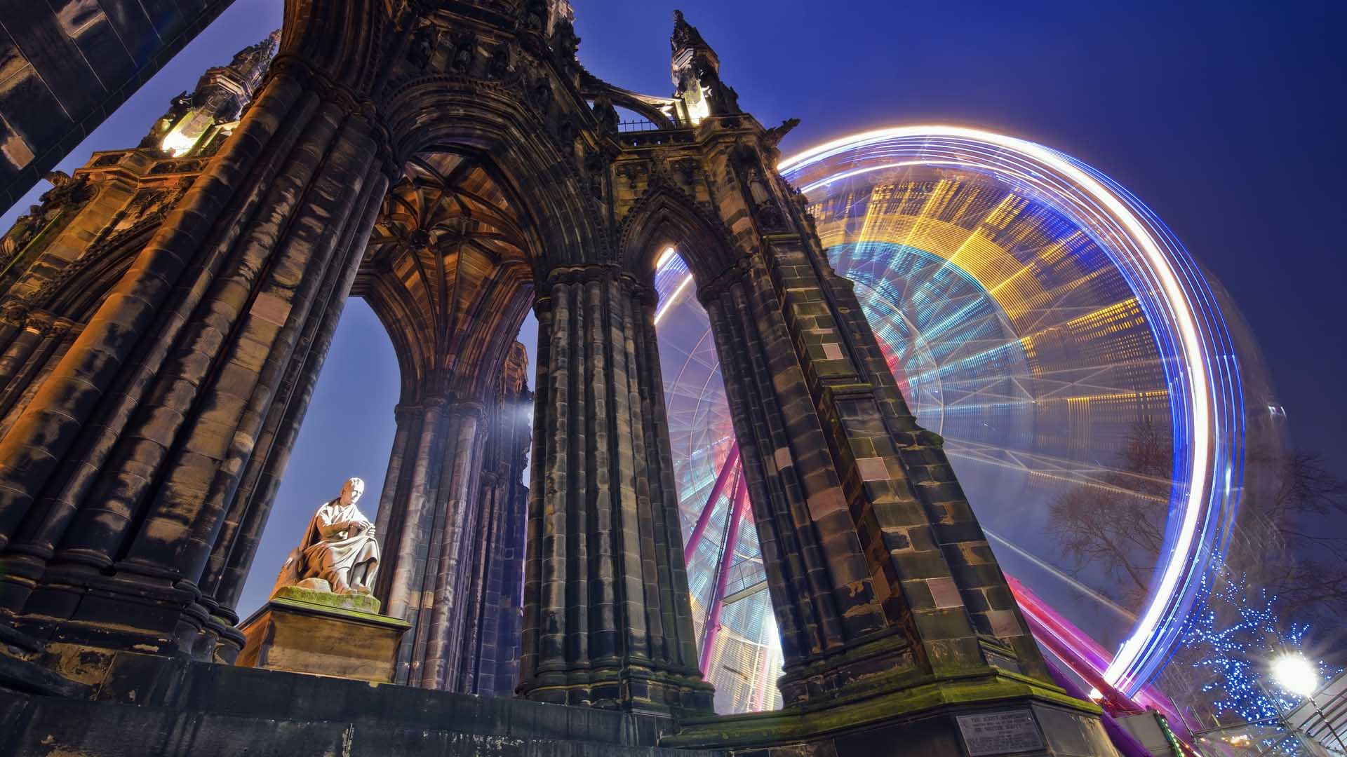 Scott-Monument-and-russian-wheel-in-the-background-Edinburgh-Scotland