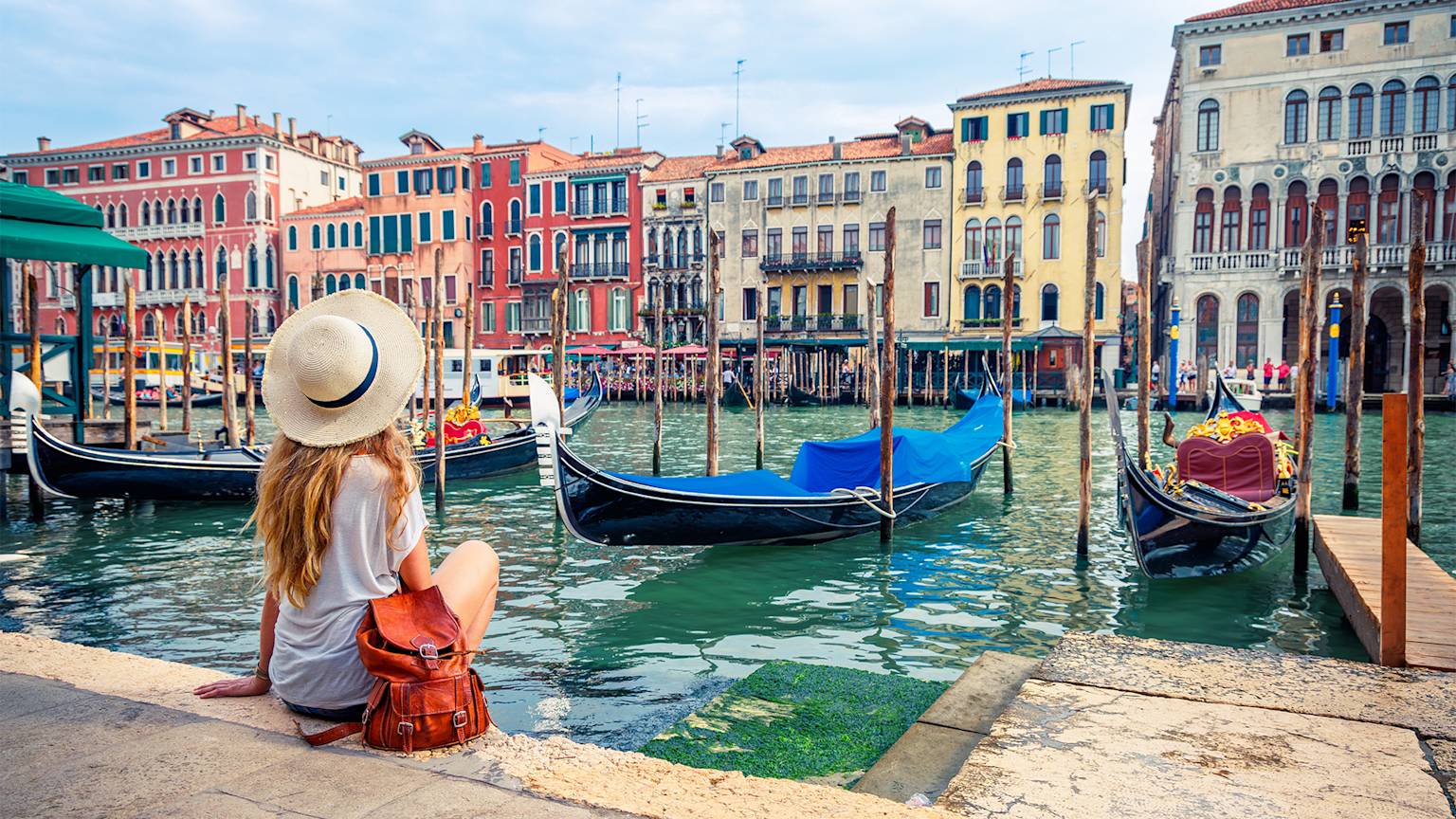 Venice-girl-by-the-water-italy-swiper-hero-gallery