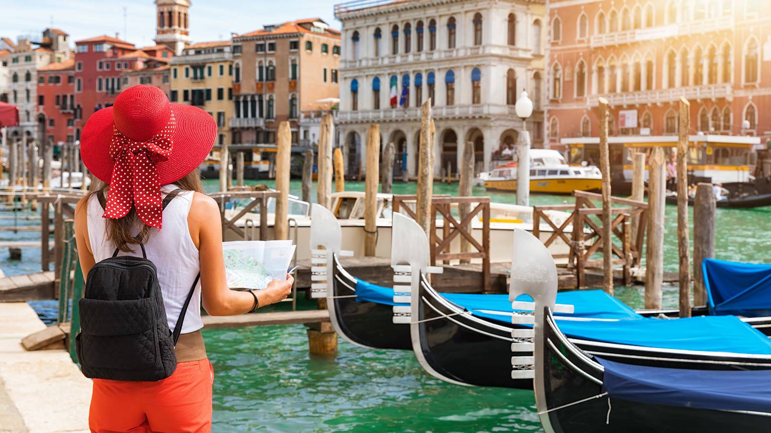 italy-venice-tourist-woman-gondola-canals-swiper-hero-gallery