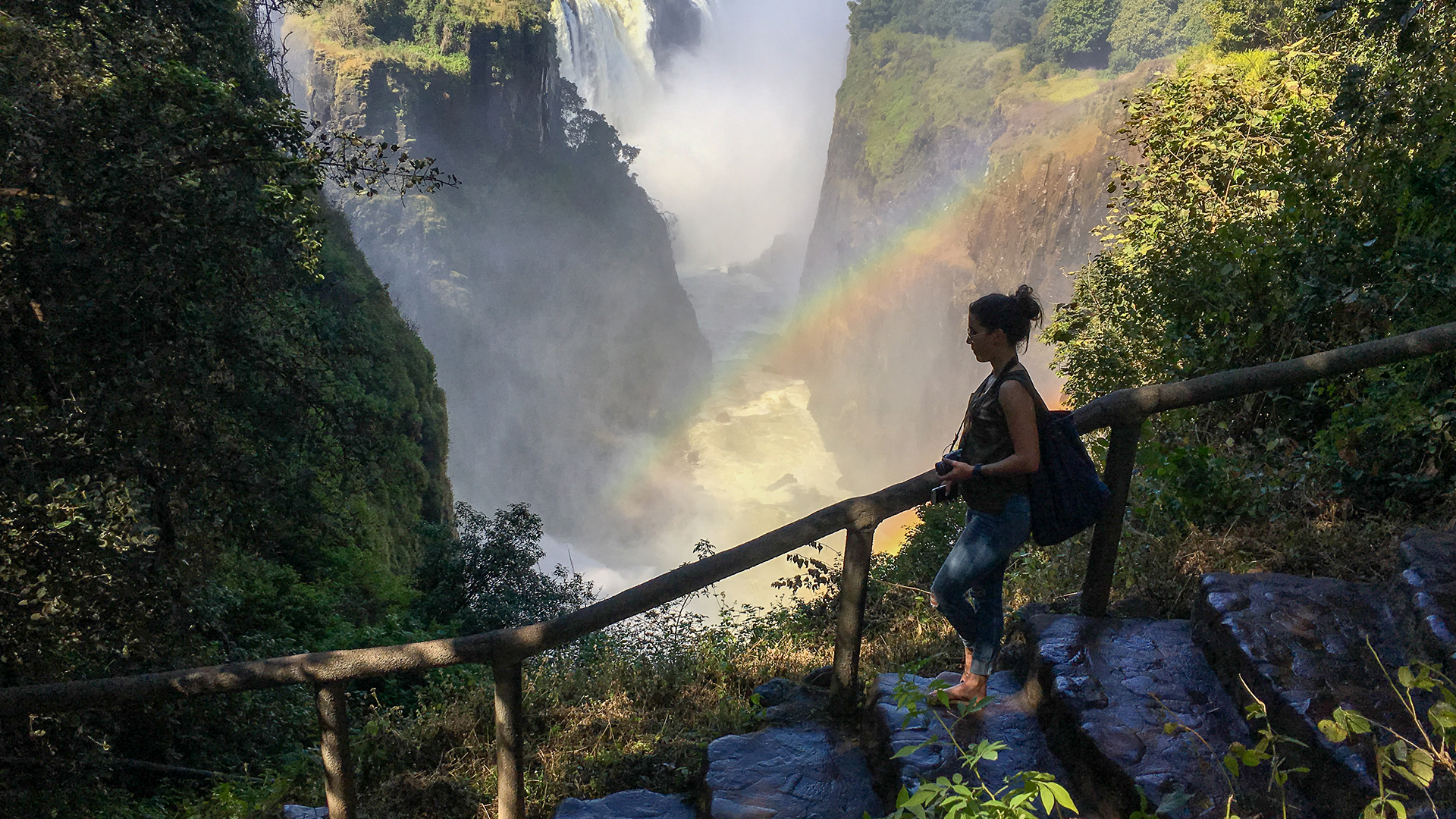 victoria-falls-lady-walking-zimbabwe
