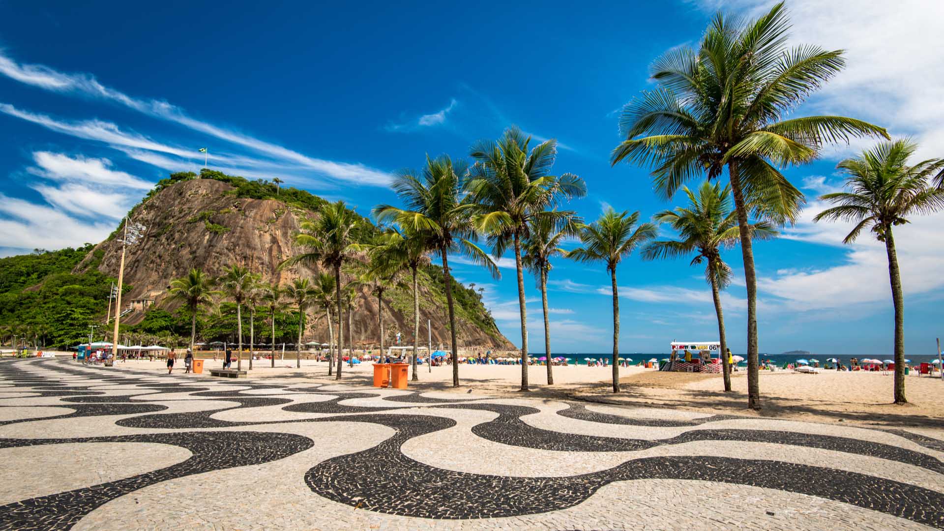 famous-mosaic-of-sidewalk-and-palm-trees-in-leme-and-copacabana-beach-in-rio-de-janeiro-brazil