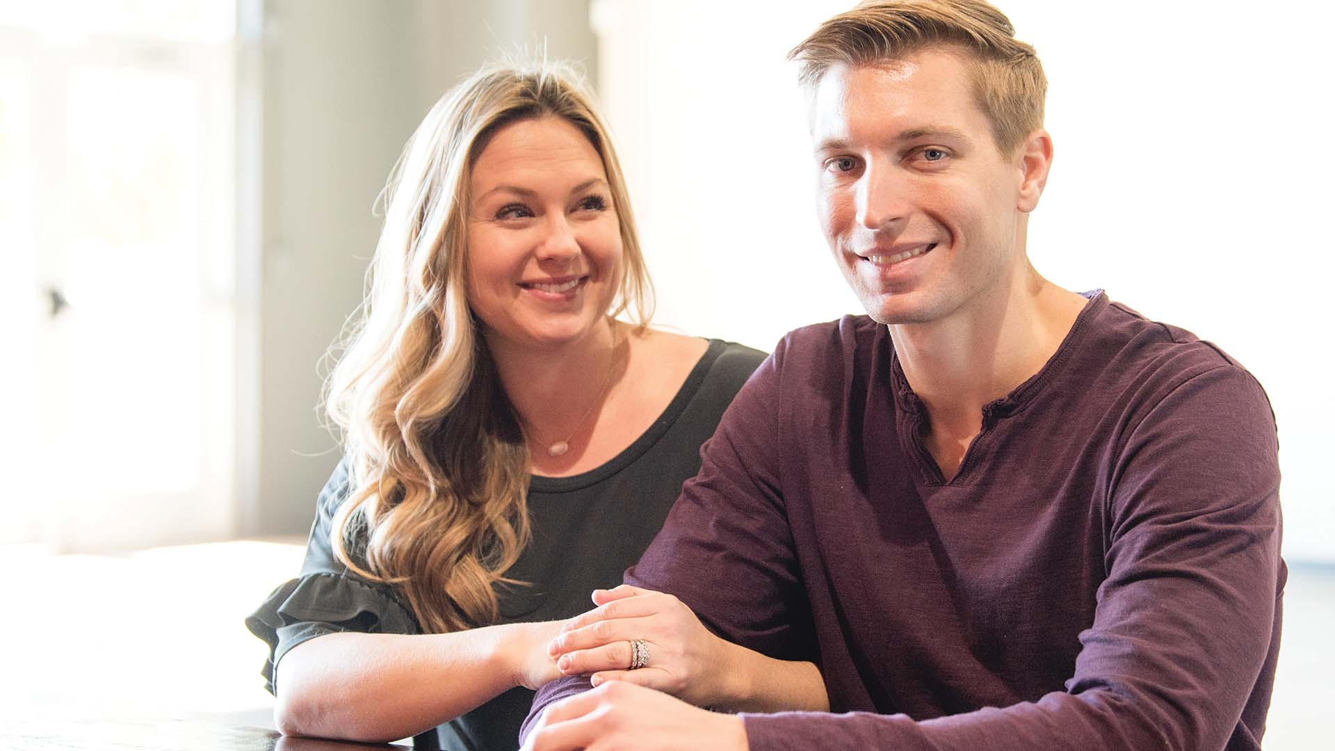 Married couple smiling.